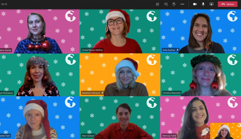 Kanslipersonalen i digitalt julkort, med pyntig utstyrsel och bakgrun